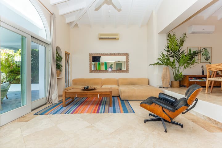 Bright living room with a sofa and lounge chair